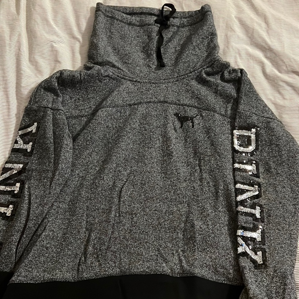 Pink pullover grey and black with silver sequent PINK down arms size Large
